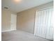Neutral bedroom with double-door closet and natural light at 9650 Sage Creek Dr, Ruskin, FL 33573