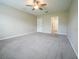 Carpeted bedroom with ceiling fan at 9650 Sage Creek Dr, Ruskin, FL 33573