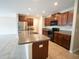 Spacious kitchen with dark wood cabinets, island and stainless-steel appliances at 9650 Sage Creek Dr, Ruskin, FL 33573