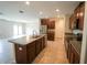 Spacious kitchen with a central island and stainless steel appliances at 9650 Sage Creek Dr, Ruskin, FL 33573