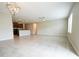 Spacious open-concept living room with ceramic tile floors and stylish light fixture at 9650 Sage Creek Dr, Ruskin, FL 33573