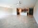 Spacious open-concept living room with ceramic tile floors and ceiling fan at 9650 Sage Creek Dr, Ruskin, FL 33573