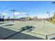 Community tennis court with lighting for evening games at 9650 Sage Creek Dr, Ruskin, FL 33573