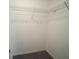 Walk-in closet with wire shelving and neutral colored walls at 9650 Sage Creek Dr, Ruskin, FL 33573