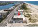 Wonderful aerial view of building near beach, inter coastal waterway and community pool at 10280 Gulf Blvd # 12, St Petersburg, FL 33706