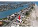 Panoramic aerial view of a building with pool close to the beach and inter coastal waterways at 10280 Gulf Blvd # 12, St Petersburg, FL 33706