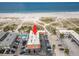 Charming aerial view of a beach side building with pool and easy beach access at 10280 Gulf Blvd # 12, St Petersburg, FL 33706