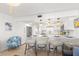 Beautiful kitchen with sleek counter seating, modern appliances, and chic nautical decor at 10280 Gulf Blvd # 12, St Petersburg, FL 33706