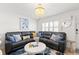 Inviting living room area showcasing a plush sofa, elegant lighting, and stylish nautical decor at 10280 Gulf Blvd # 12, St Petersburg, FL 33706