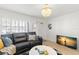 Comfortable living room with sleek leather sofa, large windows, and decorative accents throughout at 10280 Gulf Blvd # 12, St Petersburg, FL 33706