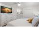 Comfortable bedroom with TV, private sink, and closet at 10280 Gulf Blvd # 12, St Petersburg, FL 33706