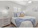 Bright bedroom with neutral tones, cozy bedding, and a ceiling fan at 10280 Gulf Blvd # 12, St Petersburg, FL 33706