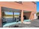 Under building patio with tables, chairs, a grill, and beach view at 10280 Gulf Blvd # 12, St Petersburg, FL 33706
