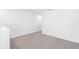 Upstairs loft space with neutral paint, plush carpet, and ample natural light at 10405 Timbercrest Rd, Spring Hill, FL 34608