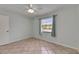 Bedroom with ceiling fan and window providing natural light at 1049 Apollo Beach Blvd # D, Apollo Beach, FL 33572