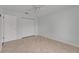Bedroom with neutral walls and tile flooring offers closet storage at 1049 Apollo Beach Blvd # D, Apollo Beach, FL 33572