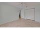 Bedroom with neutral walls, tiled floor, and closet space at 1049 Apollo Beach Blvd # D, Apollo Beach, FL 33572