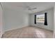 Bedroom boasts neutral decor, ceiling fan, and plenty of natural light at 1049 Apollo Beach Blvd # D, Apollo Beach, FL 33572