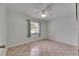 Bedroom features tile floor, ceiling fan, and bright window at 1049 Apollo Beach Blvd # D, Apollo Beach, FL 33572