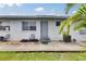 Charming single-story home with a well-maintained exterior and a small landscaped area at 1049 Apollo Beach Blvd # D, Apollo Beach, FL 33572