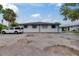 The exterior view of this single story home offers ample parking and a well maintained facade at 1049 Apollo Beach Blvd # D, Apollo Beach, FL 33572