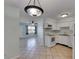Open layout kitchen with views of a large living area at 1049 Apollo Beach Blvd # D, Apollo Beach, FL 33572