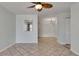 Open living room with tile flooring, ceiling fan and light blue walls at 1049 Apollo Beach Blvd # D, Apollo Beach, FL 33572