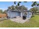 Backyard with patio area and an air conditioning unit at 11451 82Nd Ave, Seminole, FL 33772