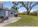 Backyard with patio, a shed, and a large tree at 11451 82Nd Ave, Seminole, FL 33772