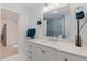 Bathroom featuring a white vanity with marble countertop, modern fixtures, and stylish decor at 11451 82Nd Ave, Seminole, FL 33772