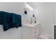 Bathroom featuring a white vanity with marble countertop, stylish hardware, and modern lighting at 11451 82Nd Ave, Seminole, FL 33772