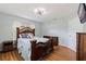 Bedroom with a ceiling fan, a wooden bed, and wood-look floors at 11451 82Nd Ave, Seminole, FL 33772