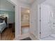 Hallway with views of multiple rooms: bedroom, bathroom with tub, and light-filled bonus room at 11451 82Nd Ave, Seminole, FL 33772