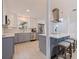 Updated kitchen boasting stainless steel appliances, sleek countertops, and an island with seating for casual dining at 11451 82Nd Ave, Seminole, FL 33772