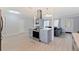 Open-concept kitchen with a modern oven, cooktop island, and seamless transition to the living area at 11451 82Nd Ave, Seminole, FL 33772