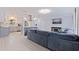 Open-concept living room with modern decor, light flooring, and an adjacent kitchen, perfect for entertaining at 11451 82Nd Ave, Seminole, FL 33772
