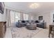 Spacious living room filled with natural light, showcasing a comfortable seating arrangement and elegant design at 11451 82Nd Ave, Seminole, FL 33772