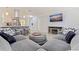 Comfortable living room featuring a large sofa, decorative ottoman, and an entertainment center at 11451 82Nd Ave, Seminole, FL 33772