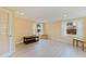 Bright room with neutral walls, wood floors, and windows dressed with white curtains at 11451 82Nd Ave, Seminole, FL 33772