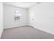 Cozy bedroom with carpet flooring and a bright window at 12027 Norvell Rd, Spring Hill, FL 34608