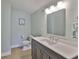 Bathroom featuring a sleek vanity, modern lighting, and updated fixtures at 12305 Freesia Ct, Riverview, FL 33569