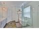 Beautiful bathroom featuring a soaking tub, frameless glass shower, and modern vanity at 12305 Freesia Ct, Riverview, FL 33569