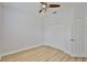Clean and modern bedroom featuring hardwood floors, a ceiling fan, and a closet with doors at 12305 Freesia Ct, Riverview, FL 33569
