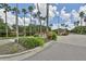 Gated community entrance with beautiful landscaping and community signage at 12305 Freesia Ct, Riverview, FL 33569