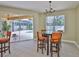 Bright dining area with backyard views with direct access to the screened lanai at 12305 Freesia Ct, Riverview, FL 33569
