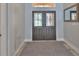 Entryway featuring a patterned rug and decorative glass front doors at 12305 Freesia Ct, Riverview, FL 33569