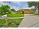 Beautifully landscaped home with a spacious front lawn and three-car garage at 12305 Freesia Ct, Riverview, FL 33569