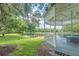 View of gazebo overlooking a peaceful pond with lush landscaping and a duck at 12305 Freesia Ct, Riverview, FL 33569