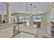 Bright kitchen featuring a center island, stainless steel appliances, and seamless flow to the living area at 12305 Freesia Ct, Riverview, FL 33569