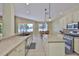 Open kitchen layout with a bar counter, stainless appliances, granite countertops, and breakfast nook at 12305 Freesia Ct, Riverview, FL 33569